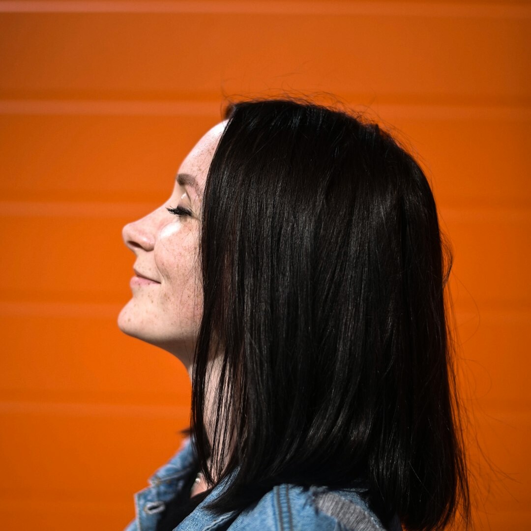 Professional woman media trainer smiling in studio